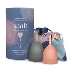 Saalt Soft menstrual cup in grey with desert blush color, held in hand for scale and comfort