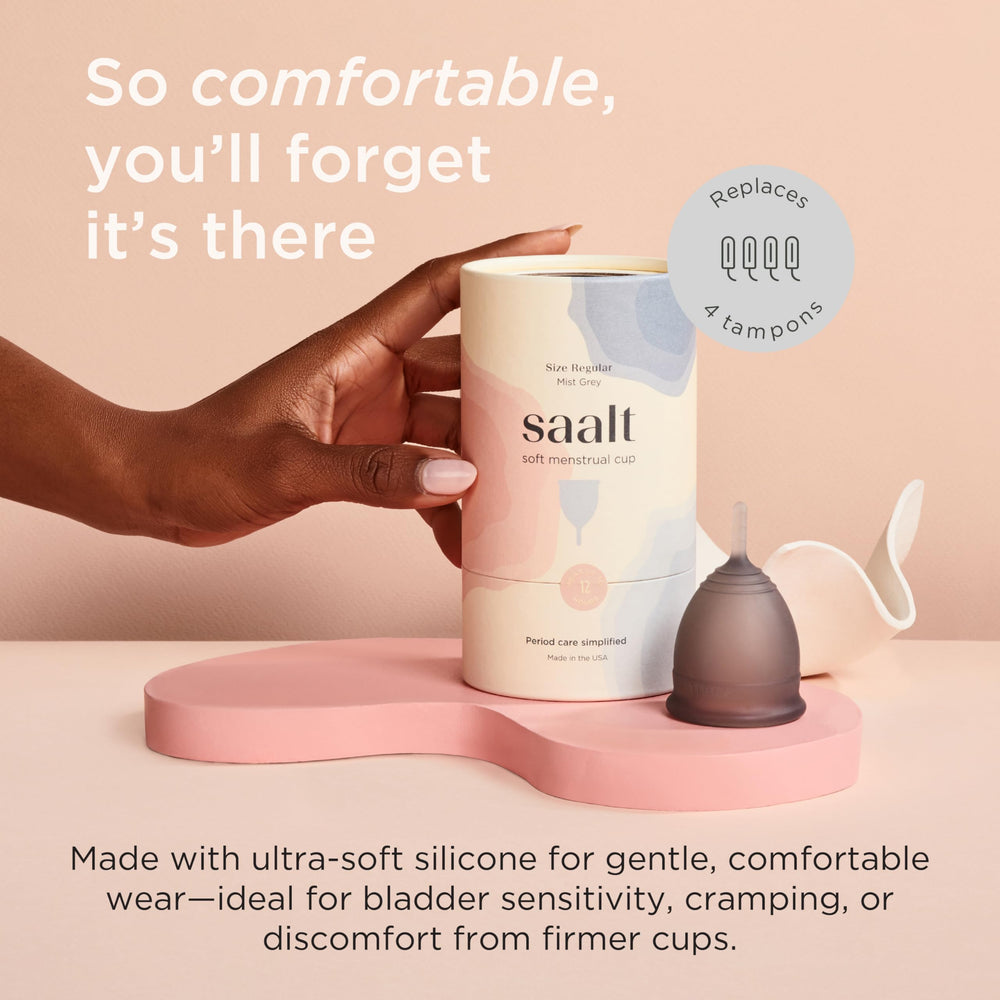 Saalt Soft menstrual cup in hand showing flexible fit for all-day comfort.