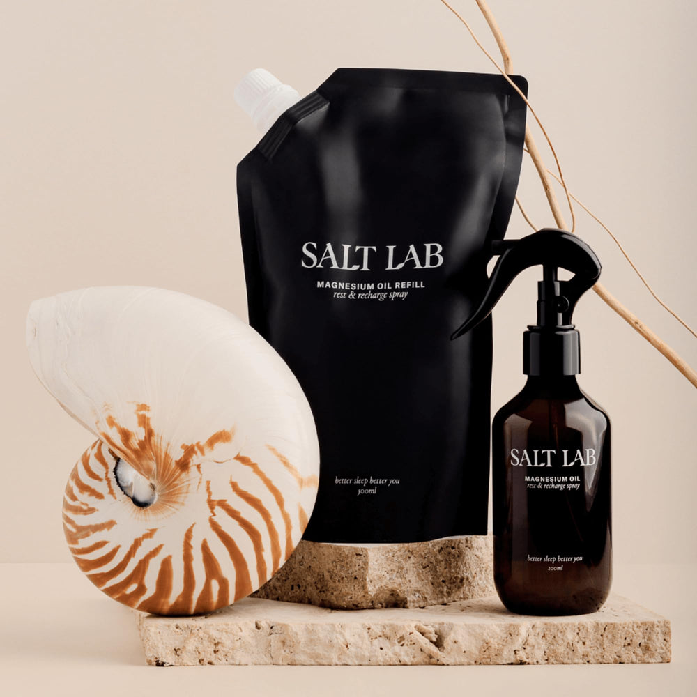 SALT LAB Magnesium Oil Spray bottle on table, 6.8 fl oz