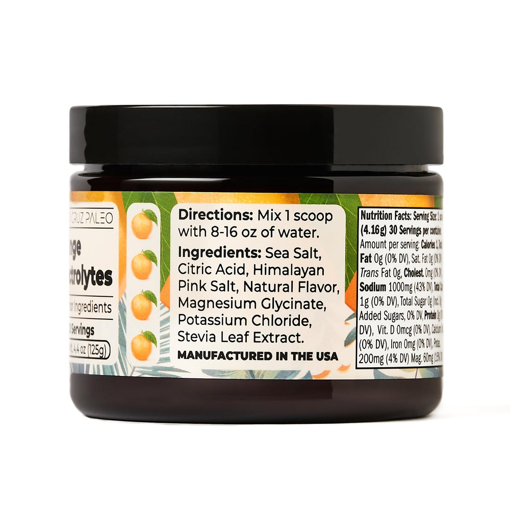 Santa Cruz Paleo Electrolyte Powder orange glass showcases refreshing, sugar-free drink.