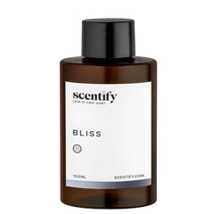 Scentify Bliss diffuser setup in a cozy room delivering a calming atmosphere.