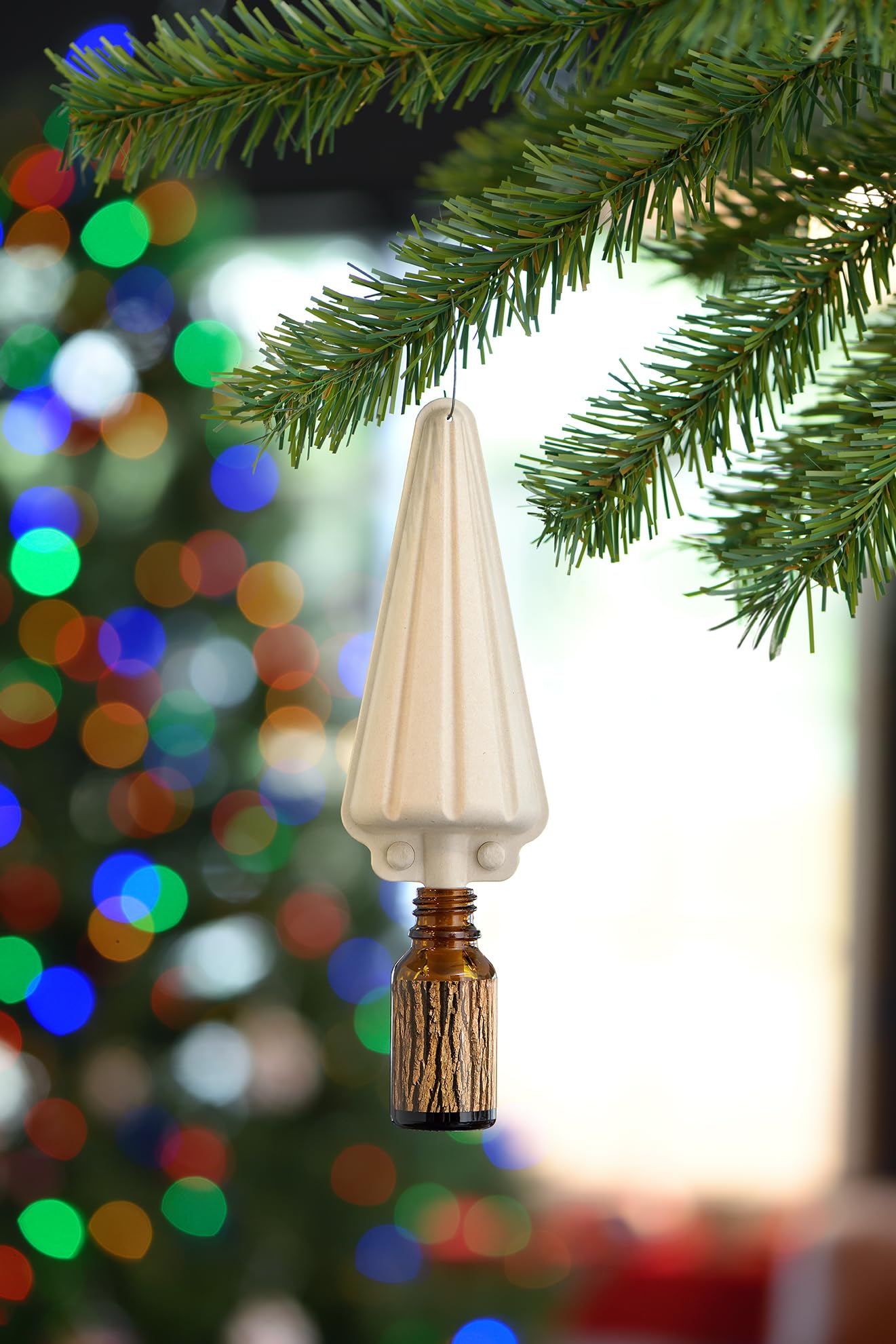ScentKeeper Christmas Tree Diffuser nestled inside a tree ornament.