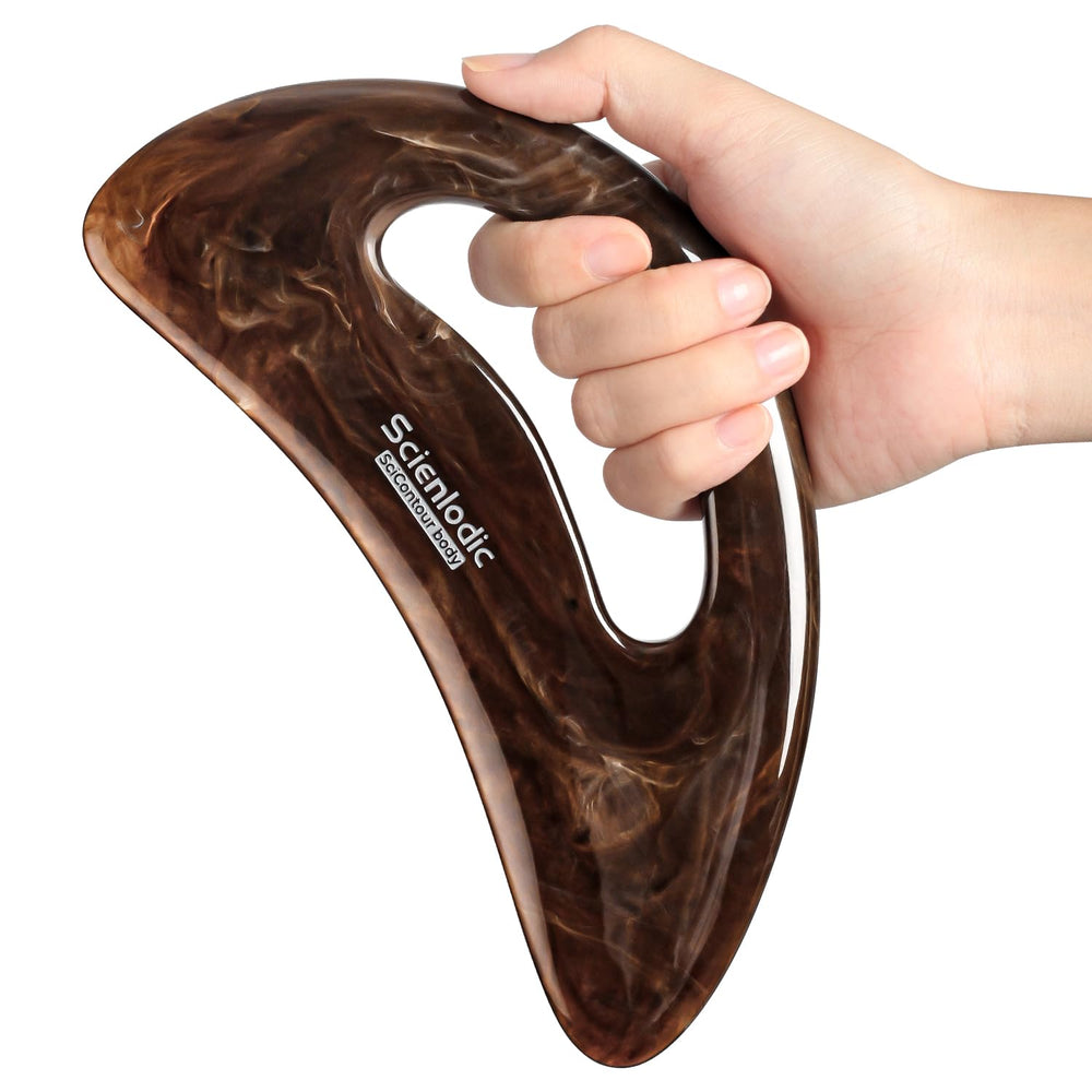 Scienlodic Gua Sha with handle in brown highlighting back massage and improved circulation.
