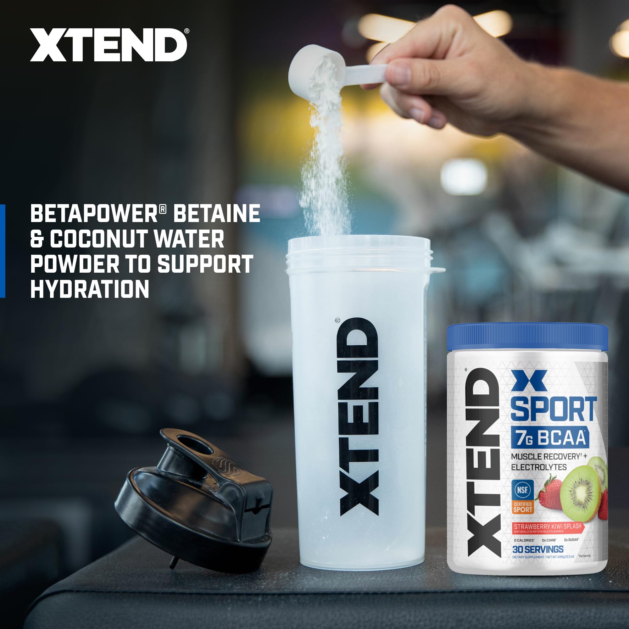 Powder scoop beside a glass showing easy pre- or post-workout mixing