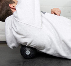 SERIOUS STEEL FITNESS massage ball for legs releases tightness in calves, hamstrings, and quads
