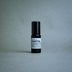 Sesneslabs Santal Grass Roll-On label highlights vegan, skin-friendly formula.