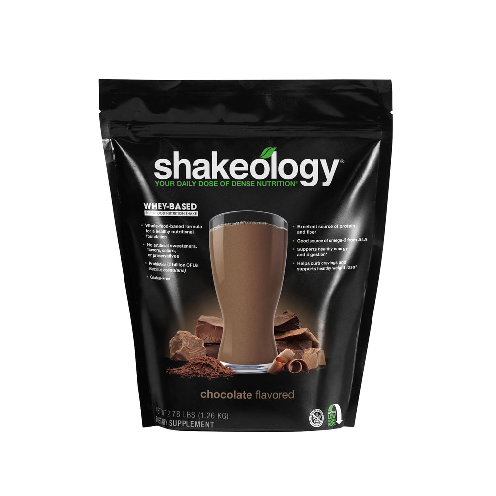 Shakeology whey protein blend glass serve shows a chocolate shake supporting lean muscle.
