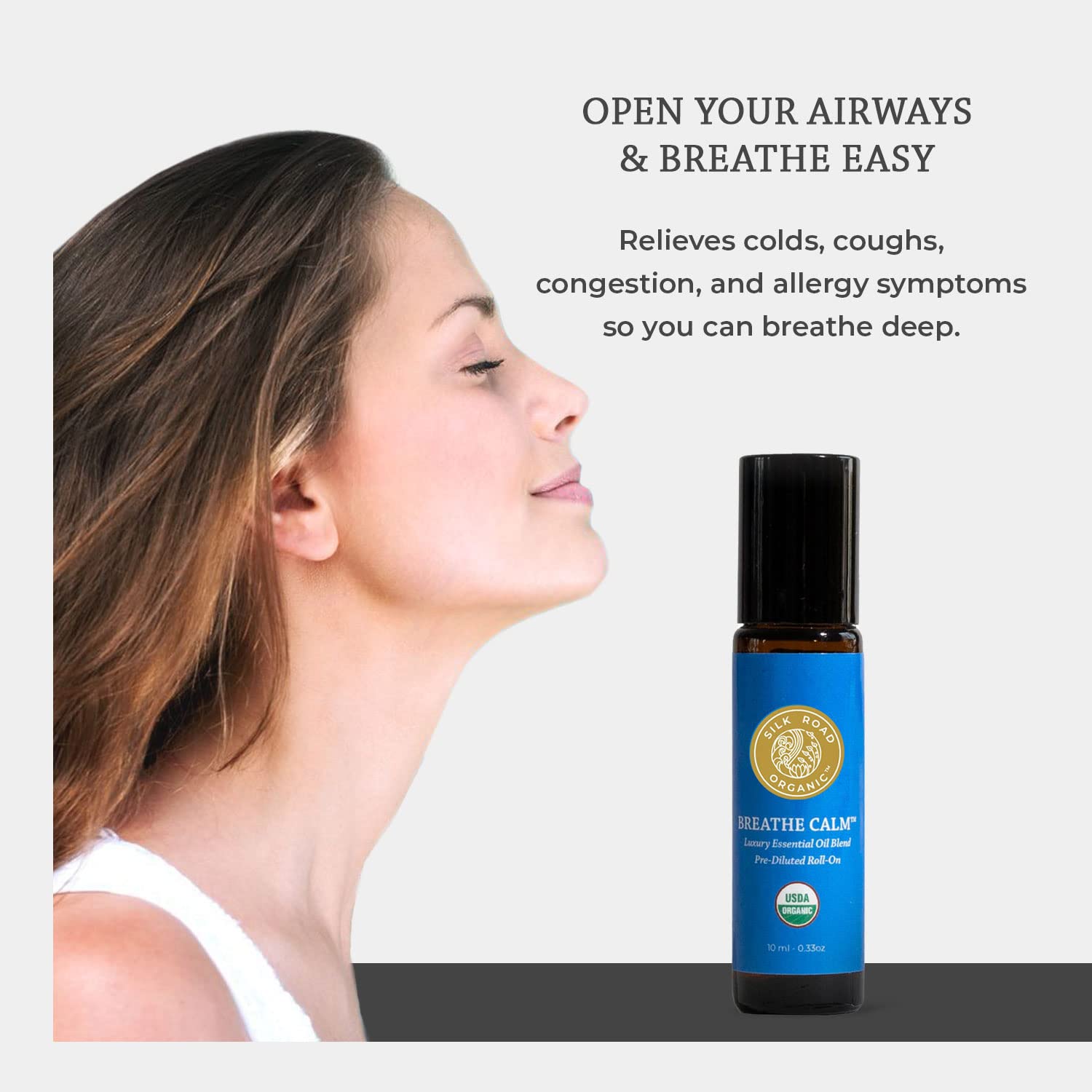 Silk Road Organic Breathe Calm rollerball in use for quick calming inhalation.