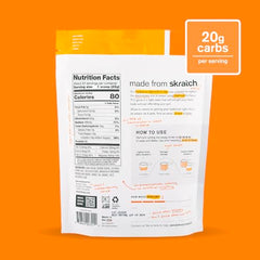 Skratch Labs Hydration Orange powder pouring into glass for quick, easy rehydration after training.