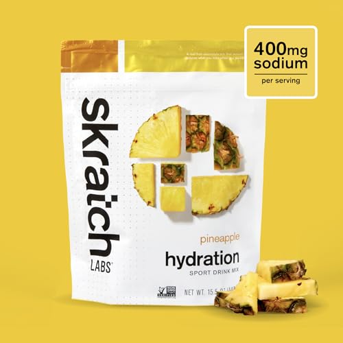 Skratch Labs Hydration Powder scoop beside a glass for quick hydration