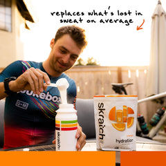 Orange Skratch Labs hydration bottle shown for during-workout hydration.