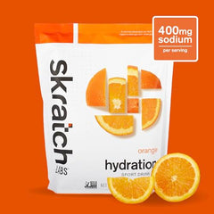 Skratch Labs hydration powder dissolving in water to release orange flavor quickly.