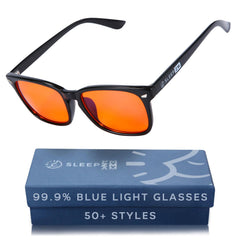 Sleep ZM blue light glasses with amber lenses worn in black wayfarer frame for evening use.