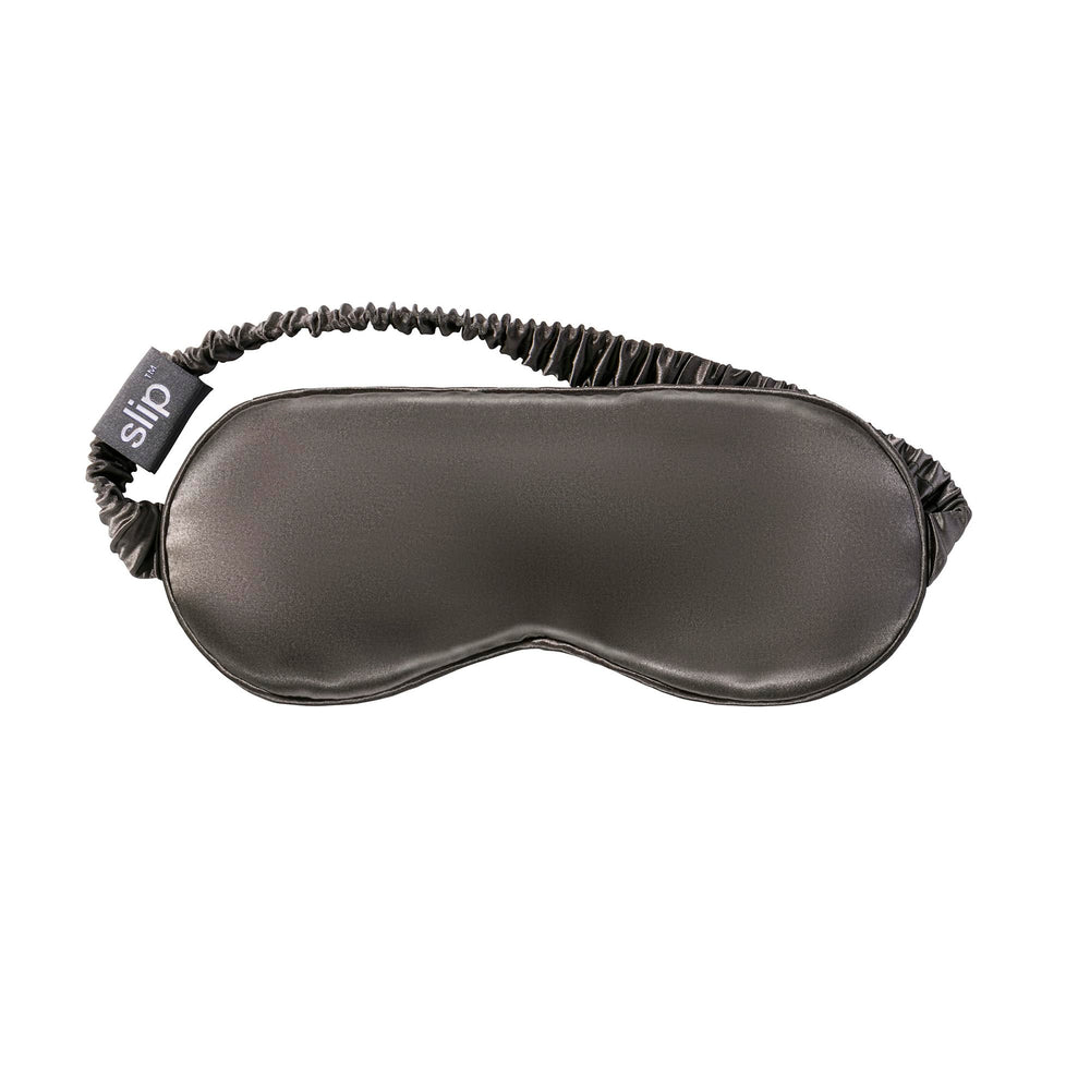 SLIP sleep mask shown with eyes closed delivering complete light blockage for restful sleep.