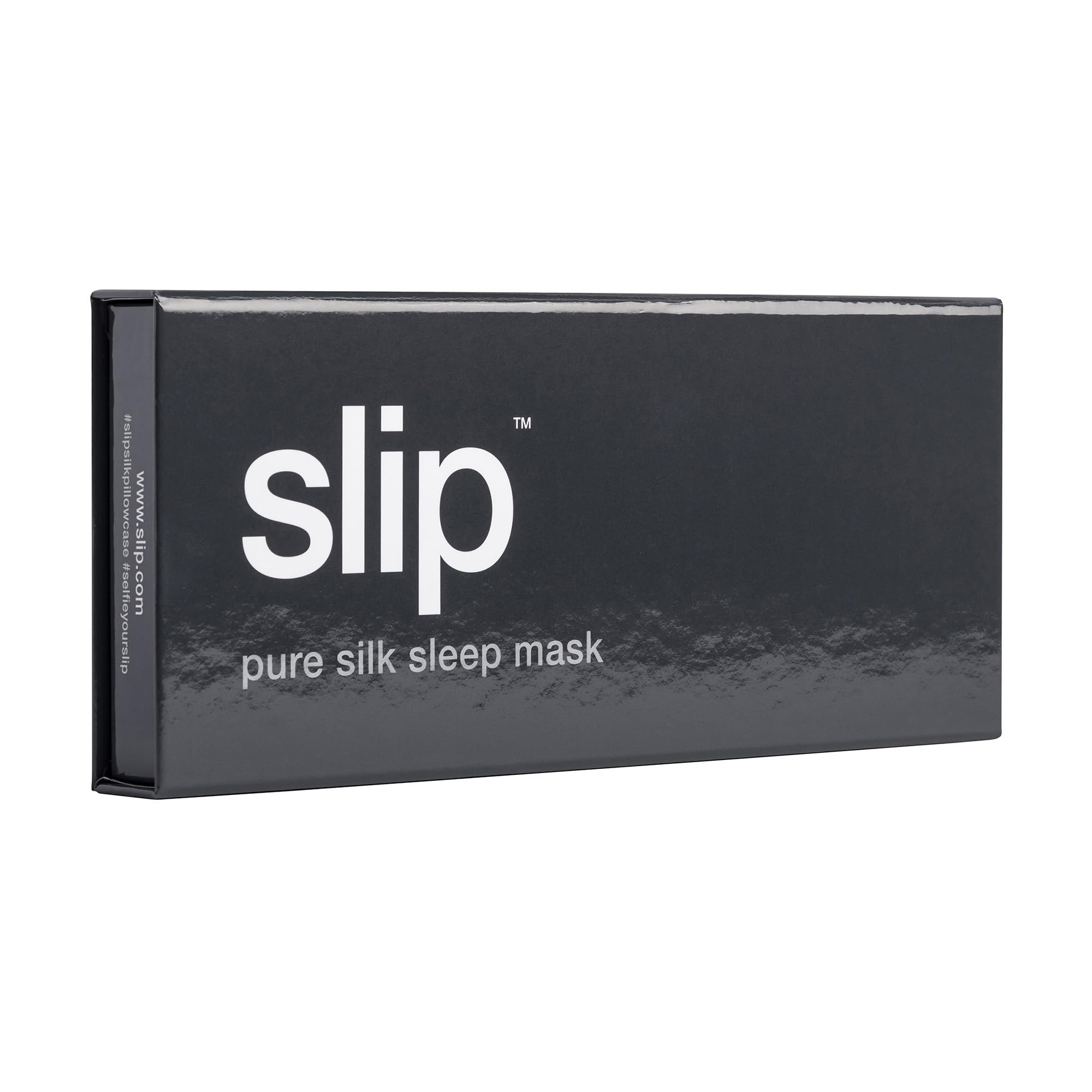 SLIP silk sleep mask beside travel case for on-the-go light protection.