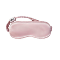 Slip light-blocking sleep mask in use, promoting uninterrupted rest away from ambient light.