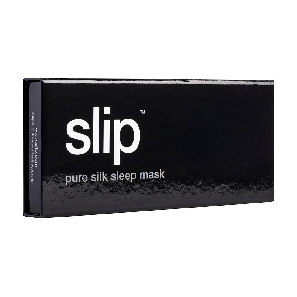 SLIP Pure Silk Sleep Mask in black worn over eyes for full light block.