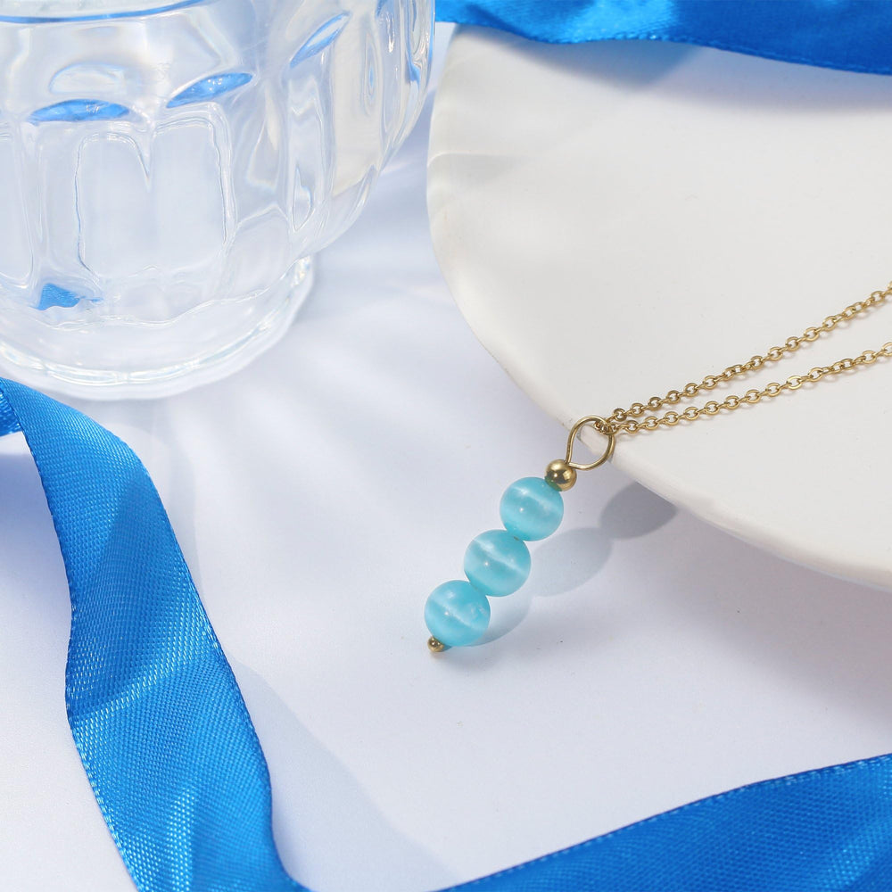 SmileBelle Aquamarine Necklace on a 14K gold-plated chain with refined shine.