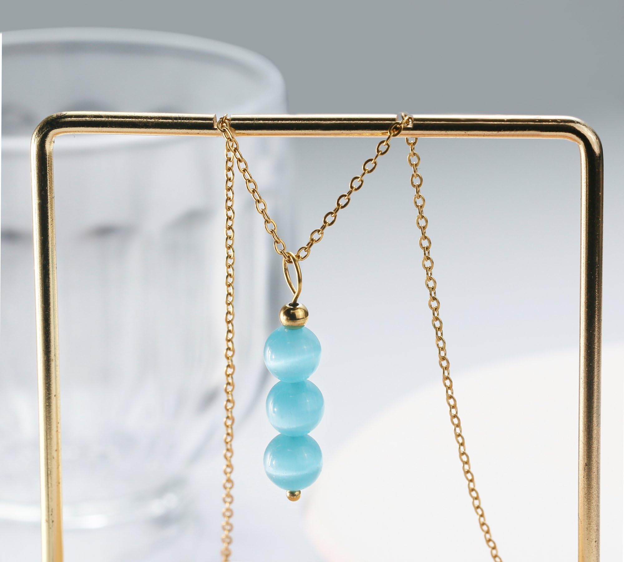 SmileBelle Aquamarine Necklace features natural gemstone beads with unique color variations.