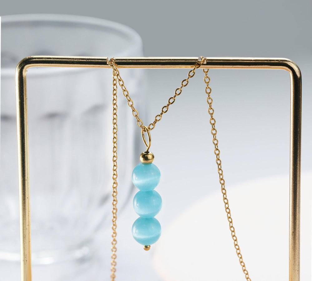 SmileBelle Aquamarine Necklace features natural gemstone beads with unique color variations.