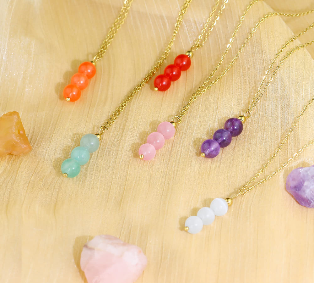 SmileBelle rose quartz necklace emits a soft romantic glow.