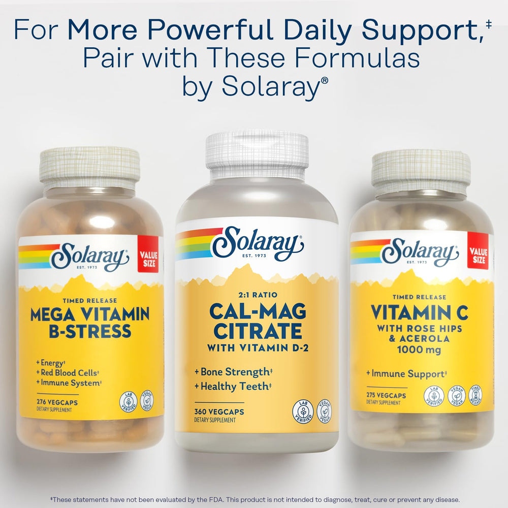 Solaray Calcium Magnesium Citrate bottle in use with a glass of water.