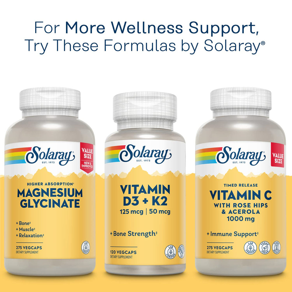 In-use scene of SOLARAY Mega Vitamin B-Stress on a desk with everyday objects.