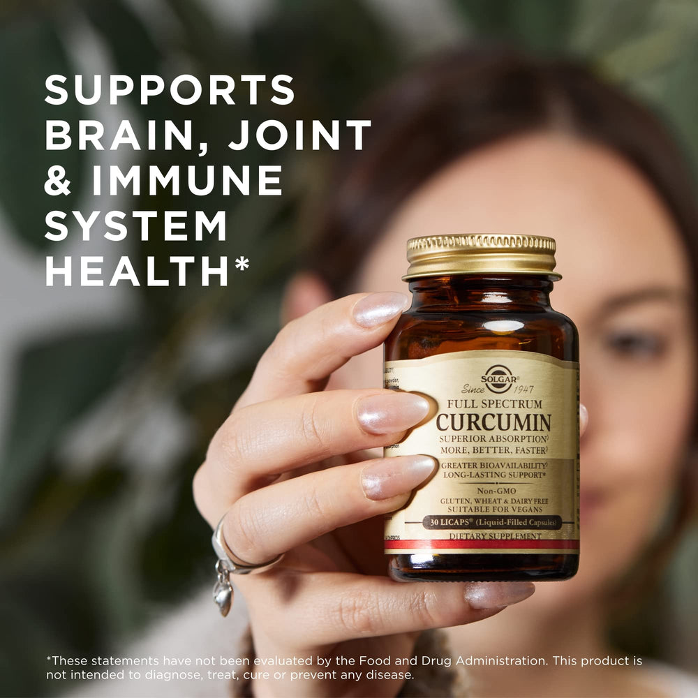 Solgar Curcumin bottle with glass of water suggests easy daily intake