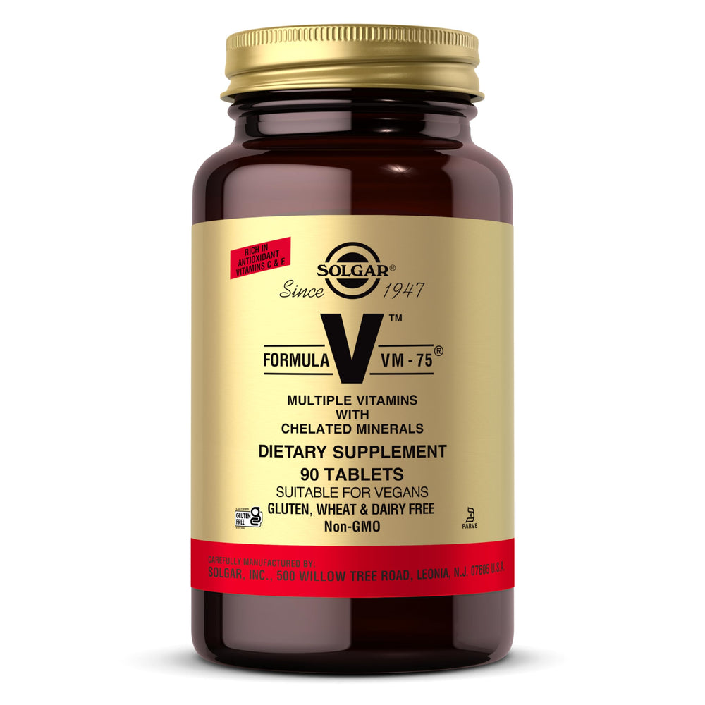 Solgar VM-75 bottle with label visible on table for daily wellness support.