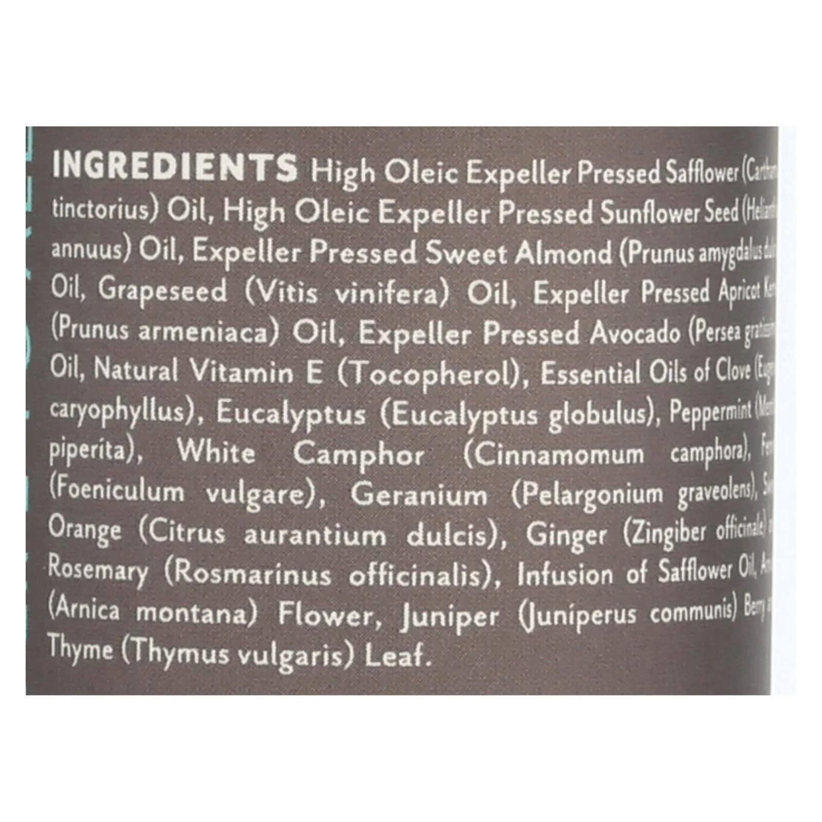 Soothing Touch Muscle Comfort massage oil in hand for soothing aromatherapy and relief.