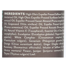 Soothing Touch Muscle Comfort massage oil in hand for soothing aromatherapy and relief.