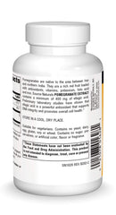 Pouring capsules shows the daily dose of Source Naturals Pomegranate Extract.