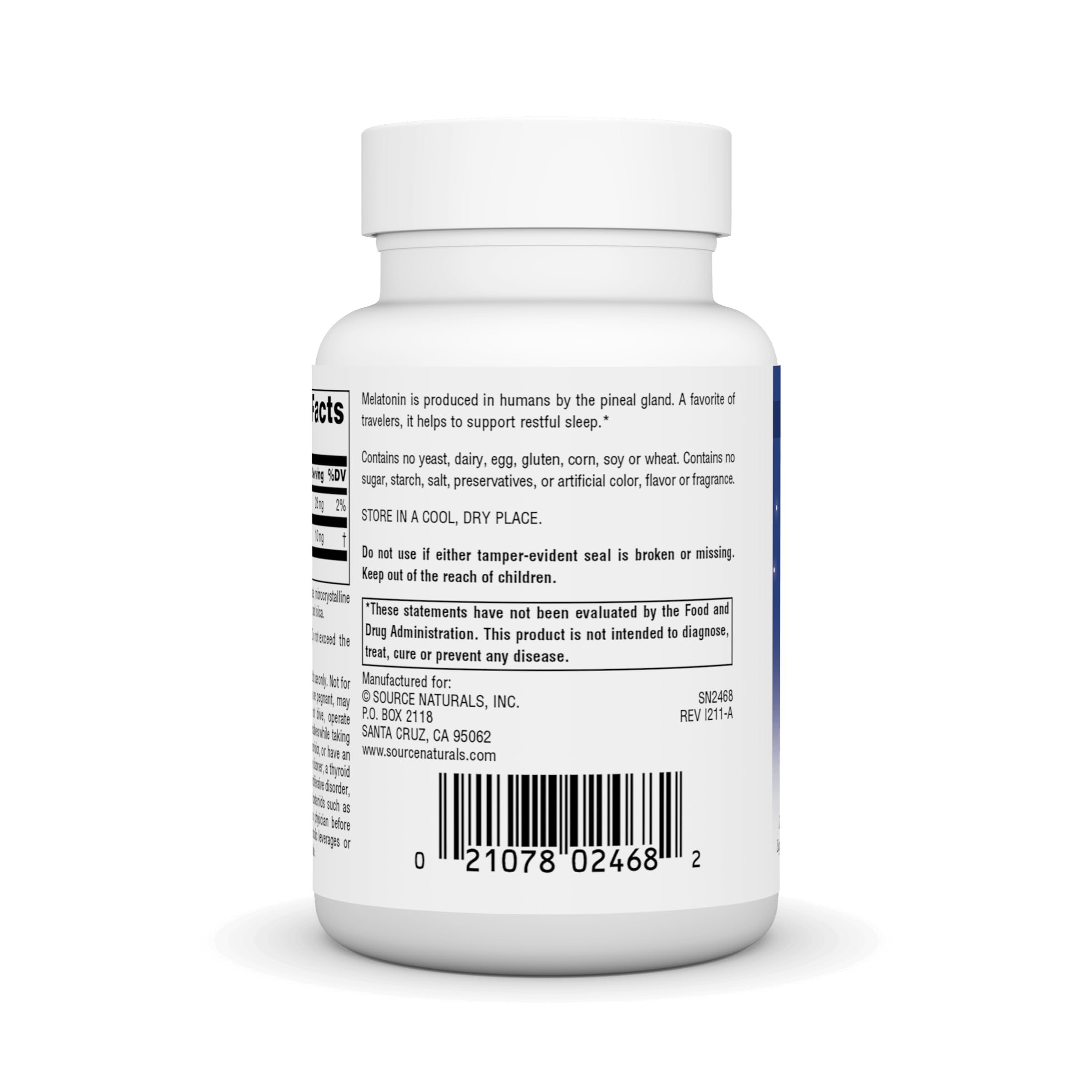 Hands holding melatonin tablet ready for bedtime routine.