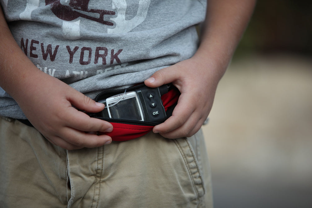 SPIbelt Diabetic Belt pass-through tubing keeps cords tidy during activities.
