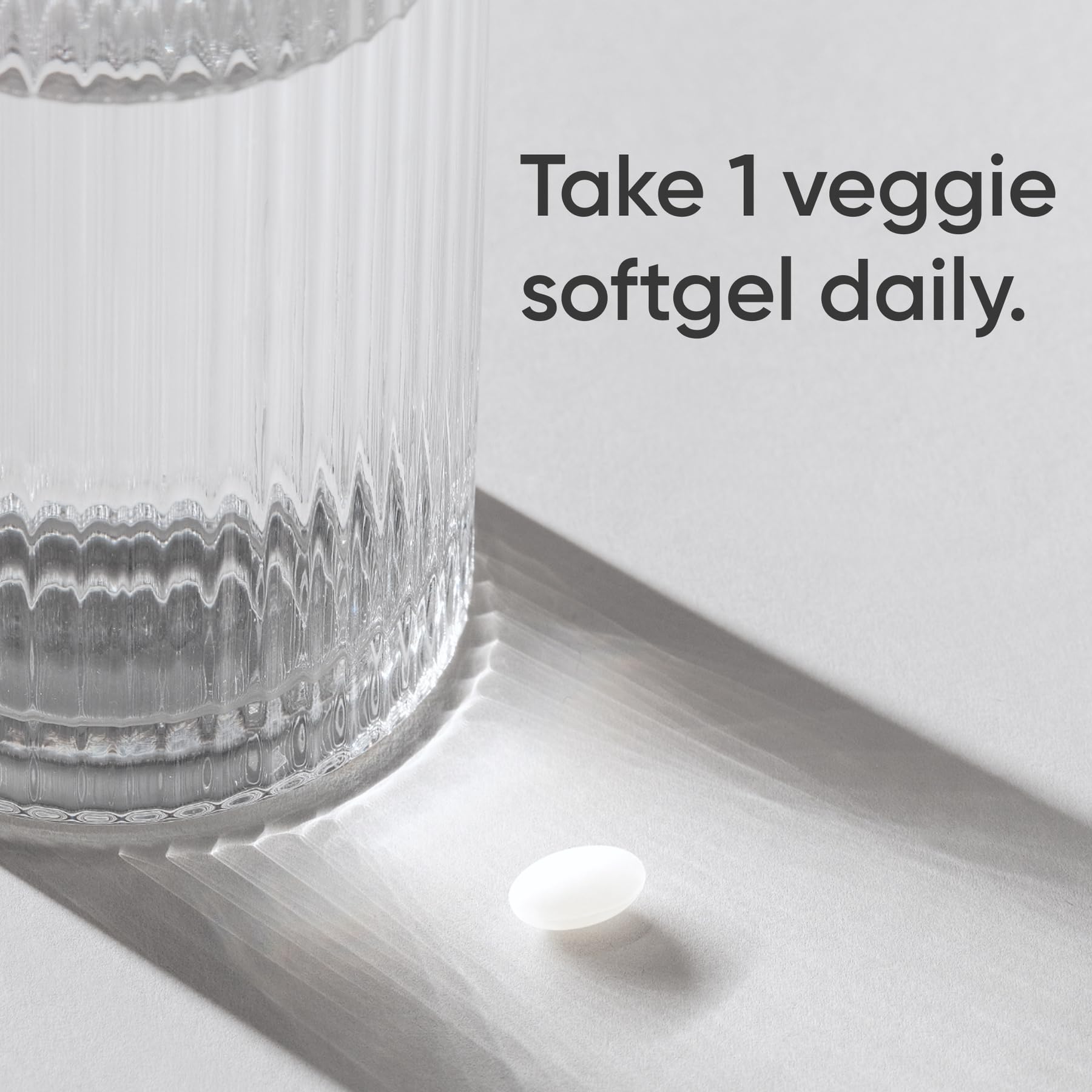 Sports Research Biotin 10,000mcg capsule closeup supports plant-based supplementation.