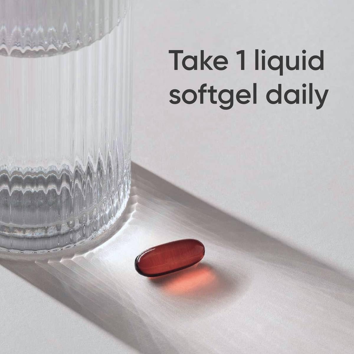 Sports Research CLA capsules in hand for daily supplementation routine.