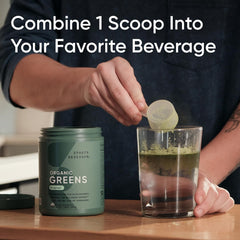 Sports Research greens powder scoop poured into a shaker for quick mix