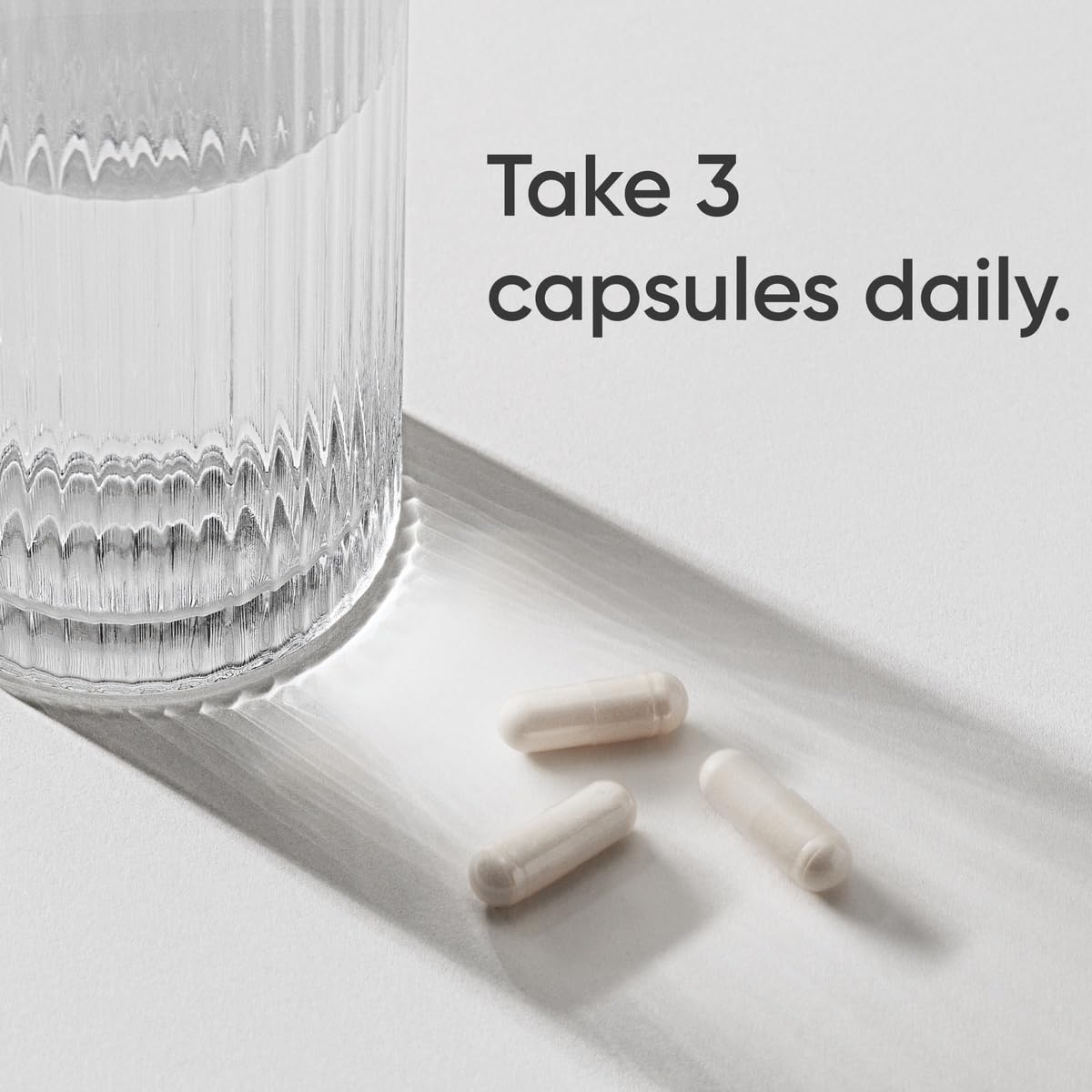 Sports Research capsules closeup highlighting easy-to-swallow texture for daily use.