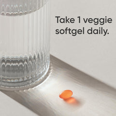 Sports Research vegan D3 + K2 with coconut oil carrier close-up, illustrating absorption aid.