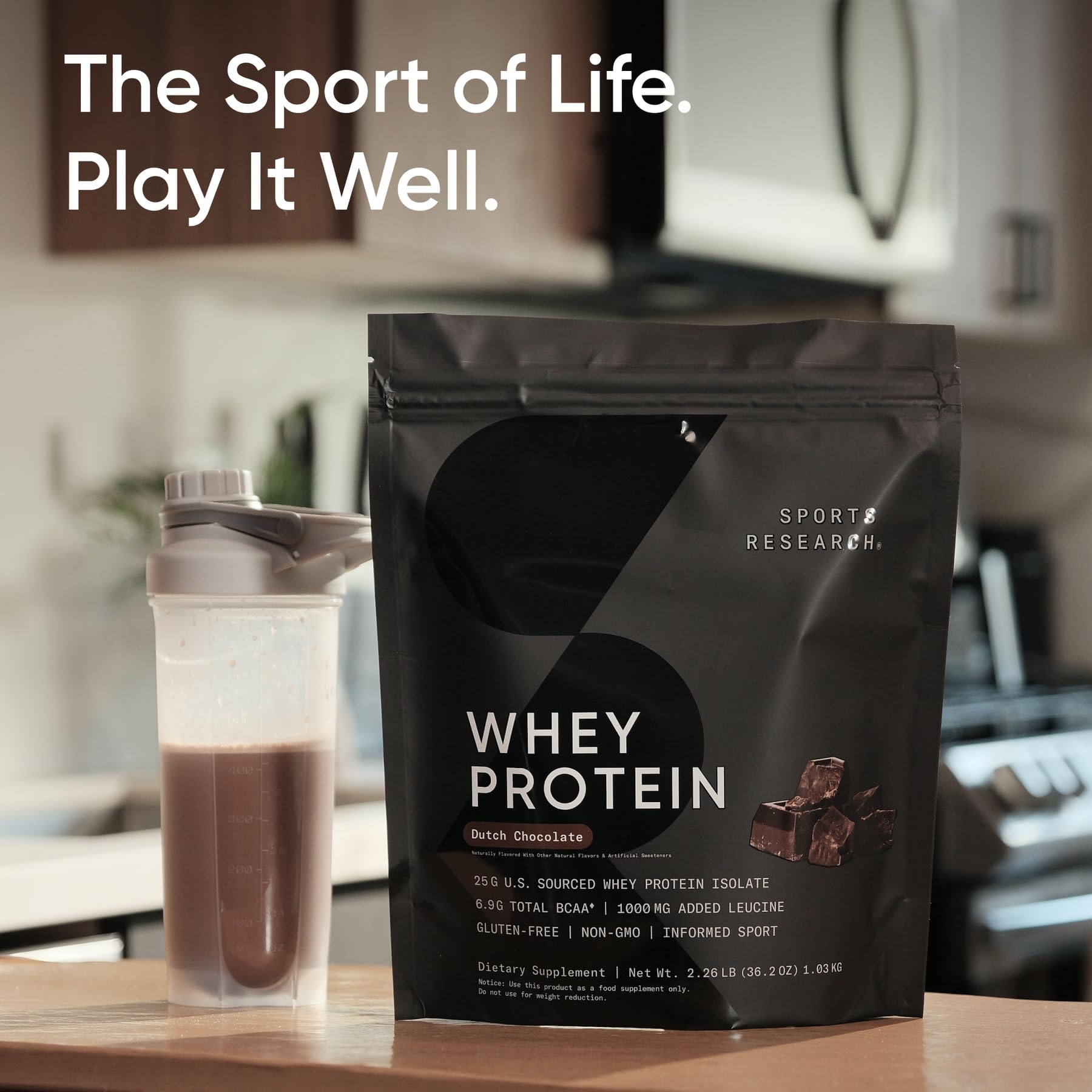 Sports Research Whey Protein stirred into coffee creamer for a protein-rich sip.