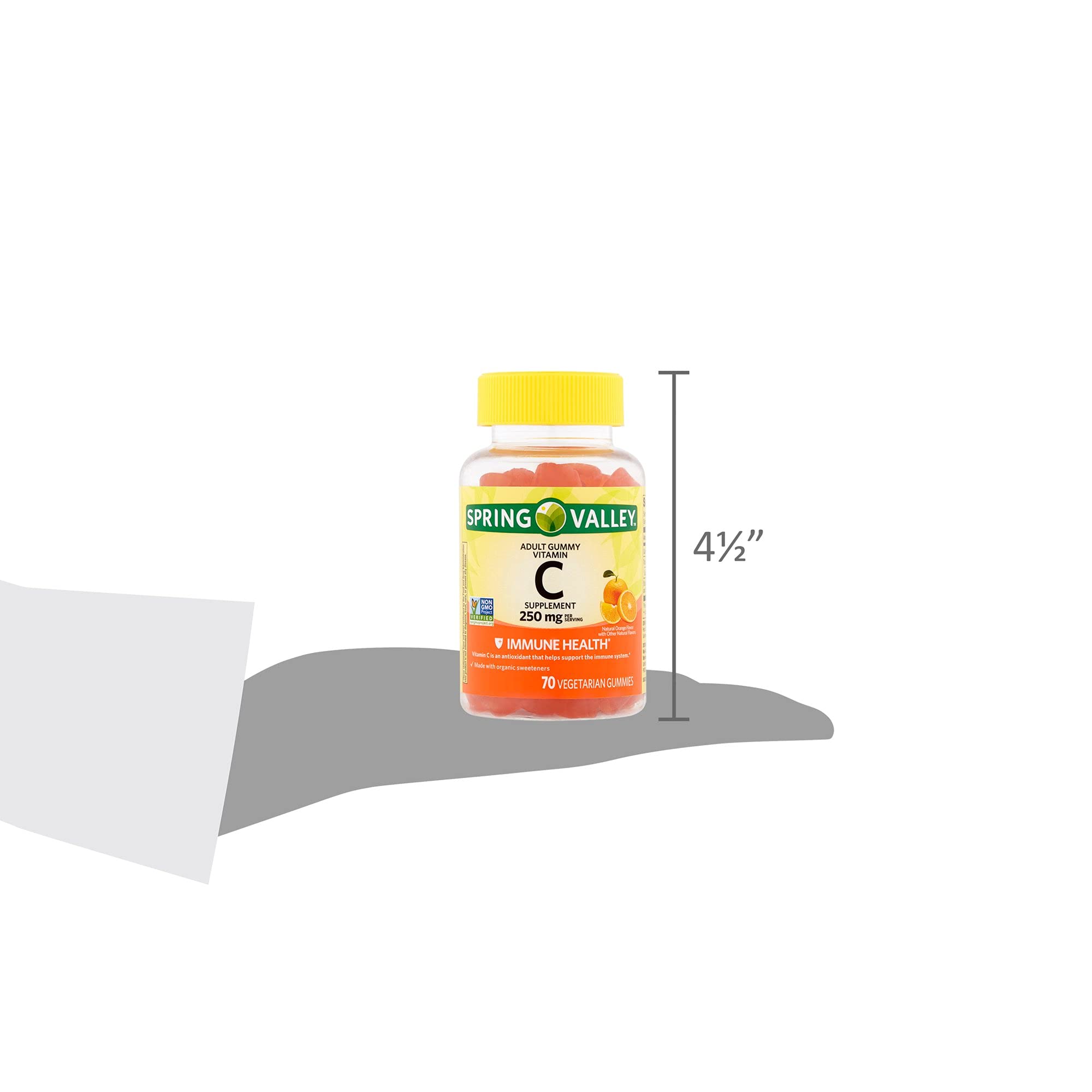 Spring Valley orange gummies texture on hand, tasty, convenient daily vitamin.