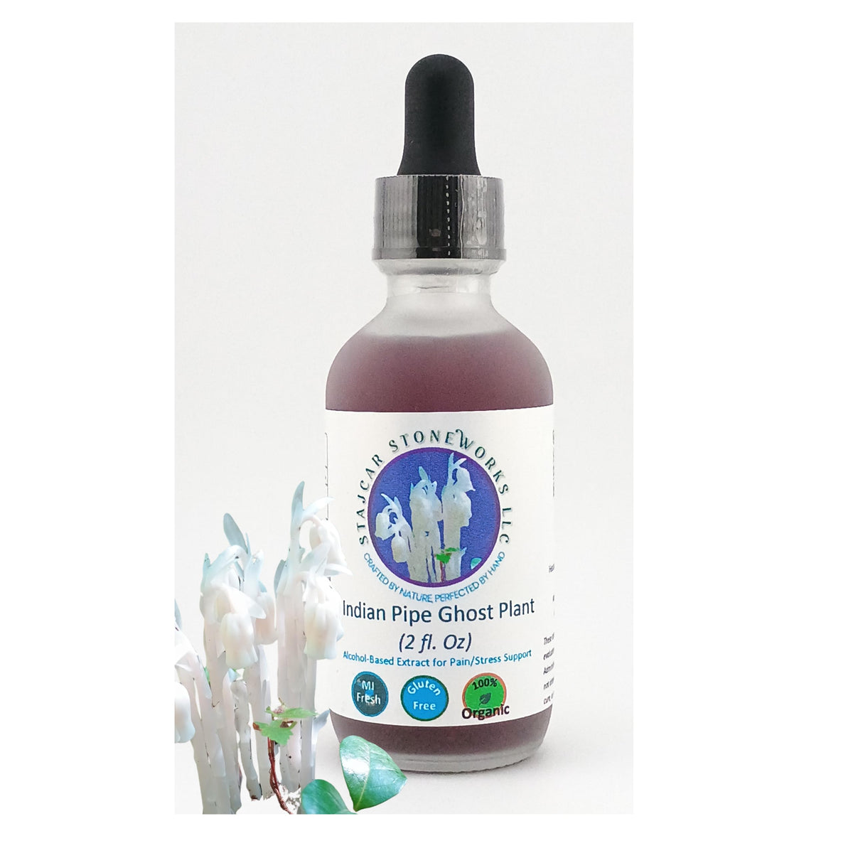 Stajcar Stoneworks Indian Pipe tincture bottle pour highlighting organic extraction.