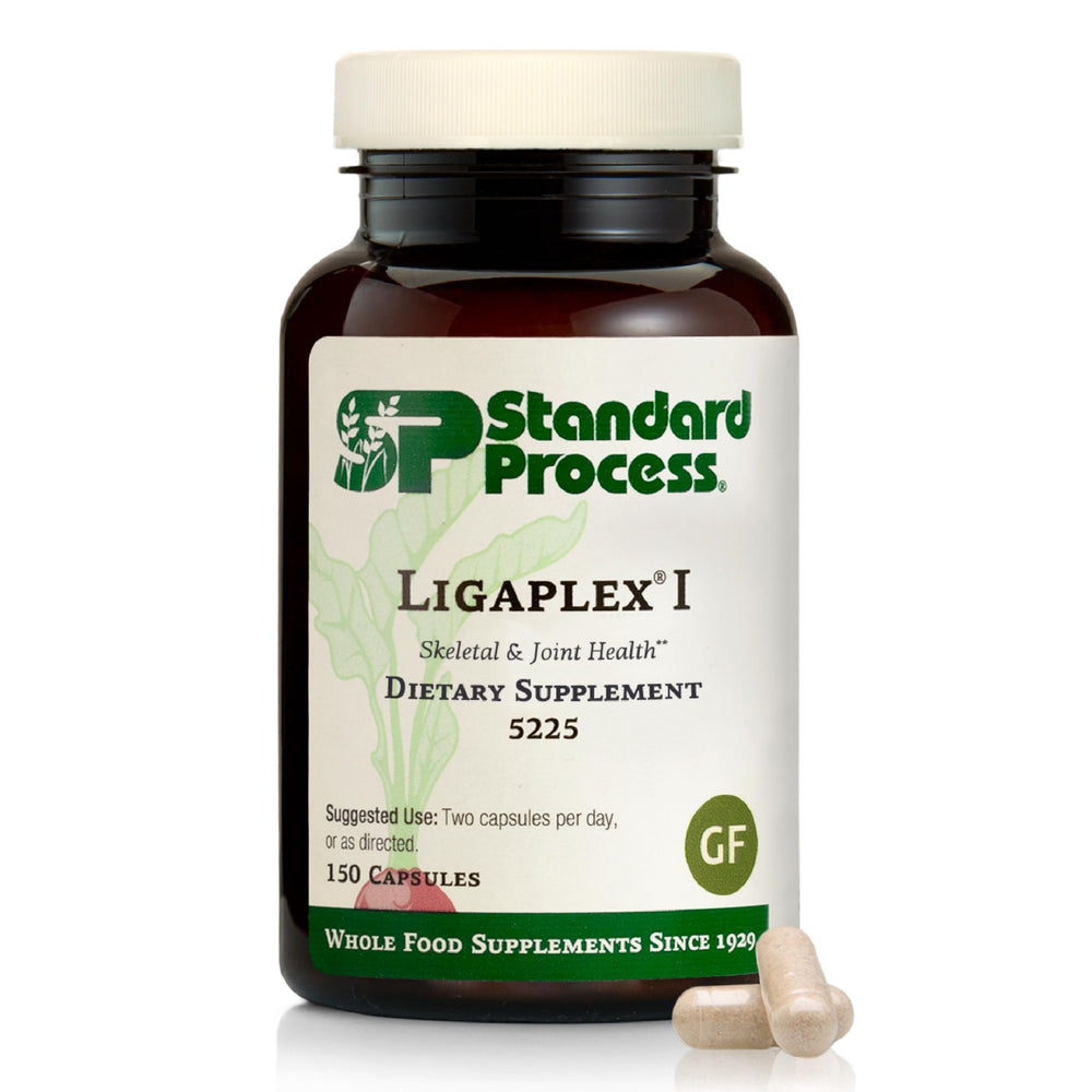 Standard Process Ligaplex I bottle closeup suggesting joint and bone support in daily use.