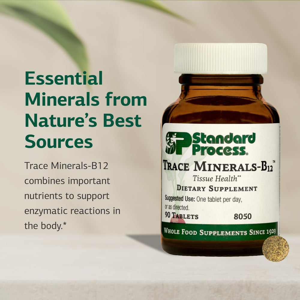 Standard Process Trace Minerals-B12 capsules on white surface for bone support
