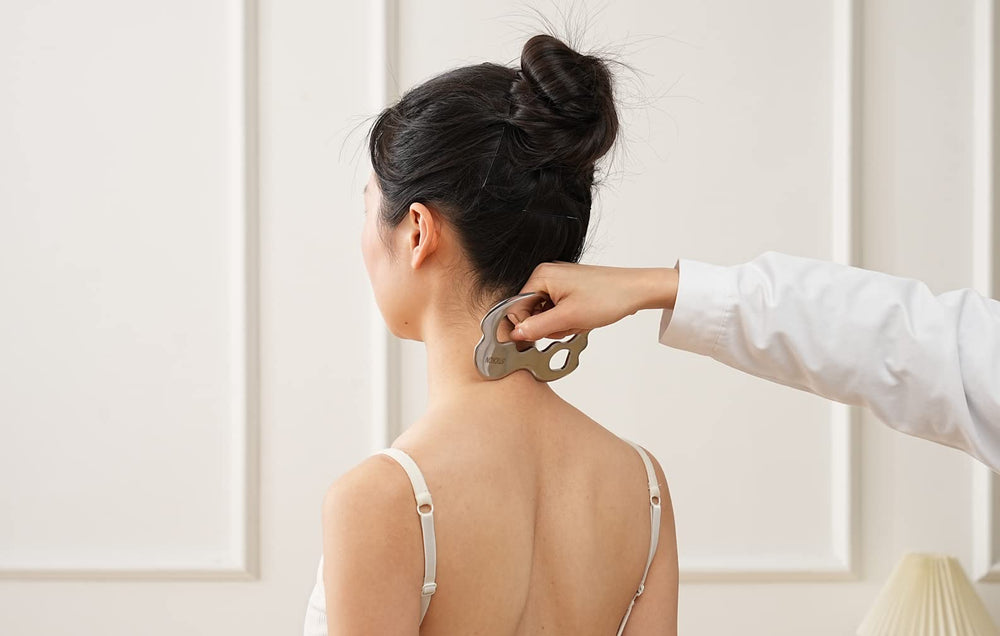 STICKON double-beveled-edge Gua Sha for targeted myofascial release.