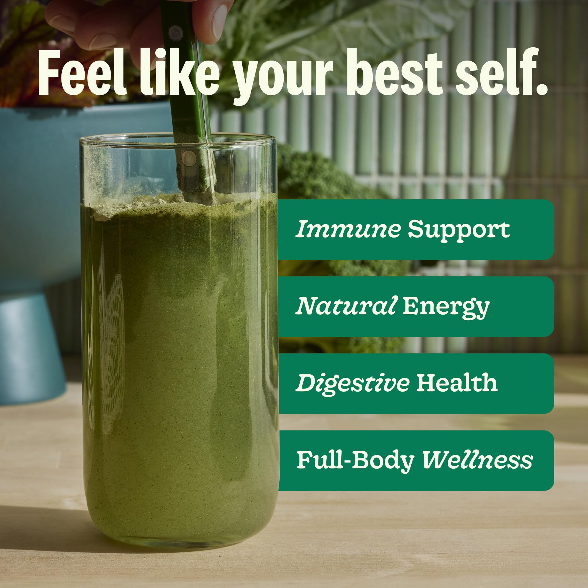Suja Organic Greens Powder spoon-dispense image emphasizes quick mix into water
