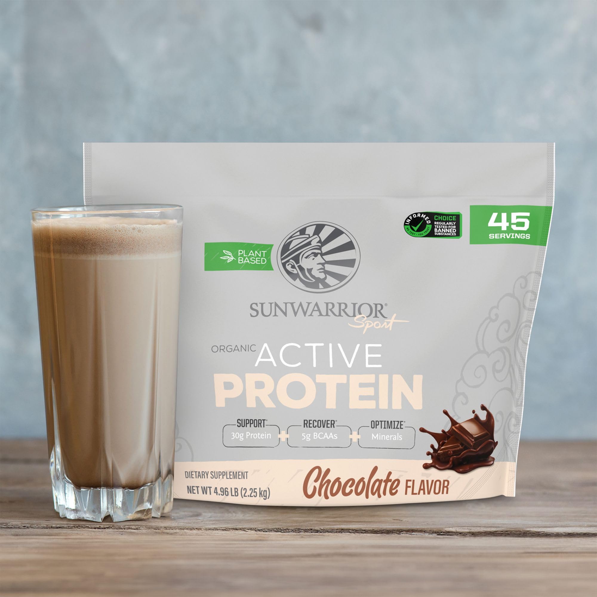 Sunwarrior organic plant-based protein powder scoop beside oats breakfast bowl
