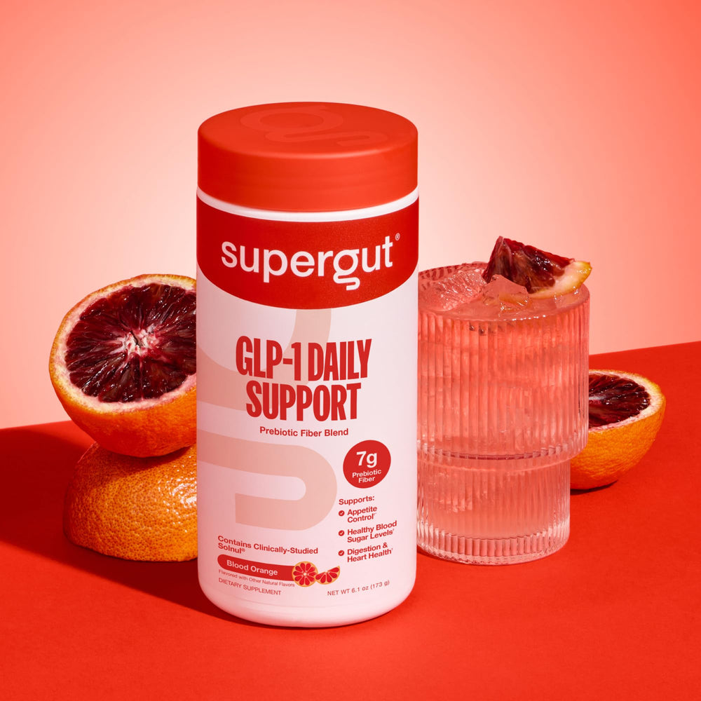 Supergut GLP-1 Daily Support powder dissolving in water for easy daily intake.