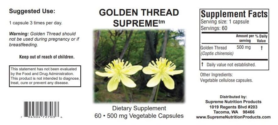 Supreme Nutrition Golden Thread capsules close-up on a wooden surface, emphasizing purity and quality.