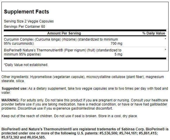 Swanson Curcumin Complex capsules closeup showing vegetarian, non-GMO formulation